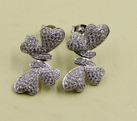 Des boucles d'oreilles en argent sterling 925 avec des pierres de zirconium cubiques, des nœuds, des boucles d'oreilles, des nœuds, un cadeau d'anniversaire pour l'amour.