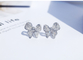 Le platine Diamond Bow Stud Earrings 0.10ct CONTRE la clarté 4.5gram a adapté aux besoins du client